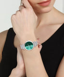 women wearing green dial metal chain analog watch