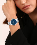 women wearing blue metal chain analog Watch