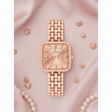 Jainx rose gold bracelet watch for women with square dial on pink satin background