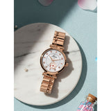 Silver dial rose gold bracelet watch for women on pastel background