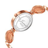 Back view of rose gold bracelet style women watch with jewelry clasp